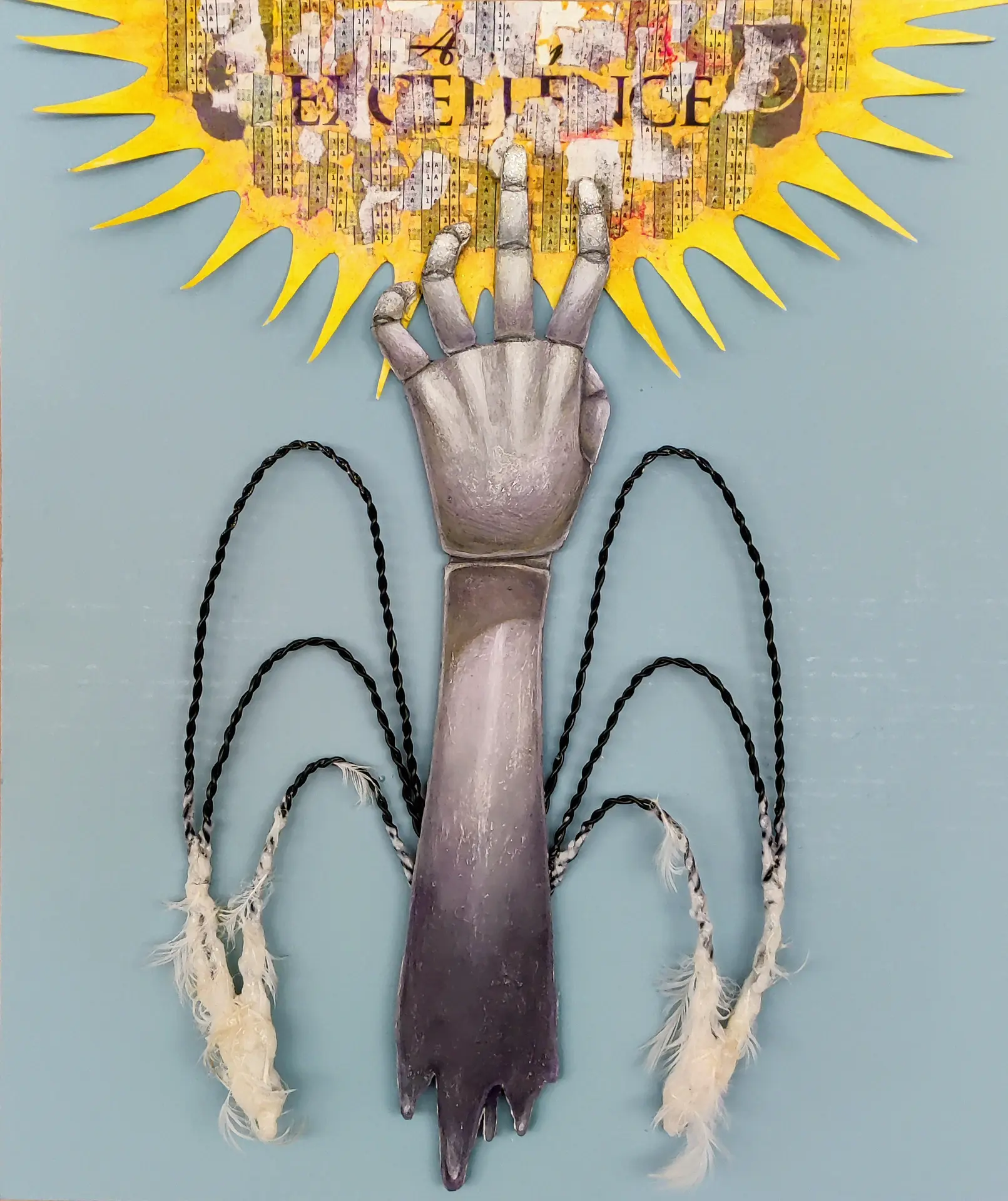 Photo of an abstracted, surrealist art piece incorporating painting, collage, and sculpture. A disembodied arm with a melted bottom reaches towards the sun; attached to the forearm is a pair of wireframe wings with some leftover wax and feathers.